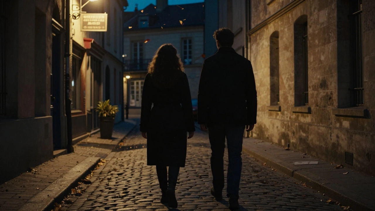 Two figures walking side by side along a quiet Parisian alley at night.